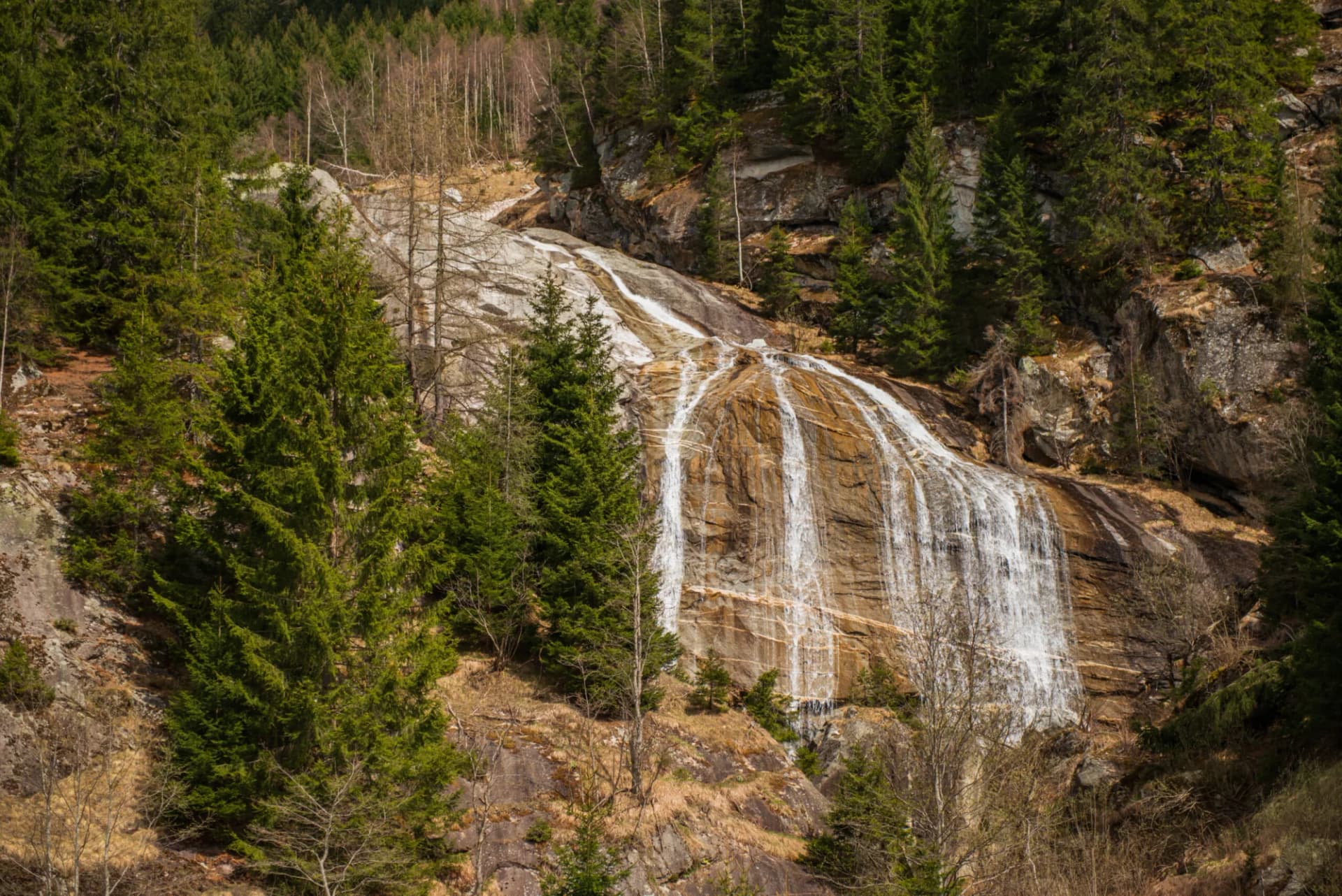 Molltaler waterfall in Innerfragant. Austria, Carinthia, april 2016. Waterfall is located near train to Molltaler glacier