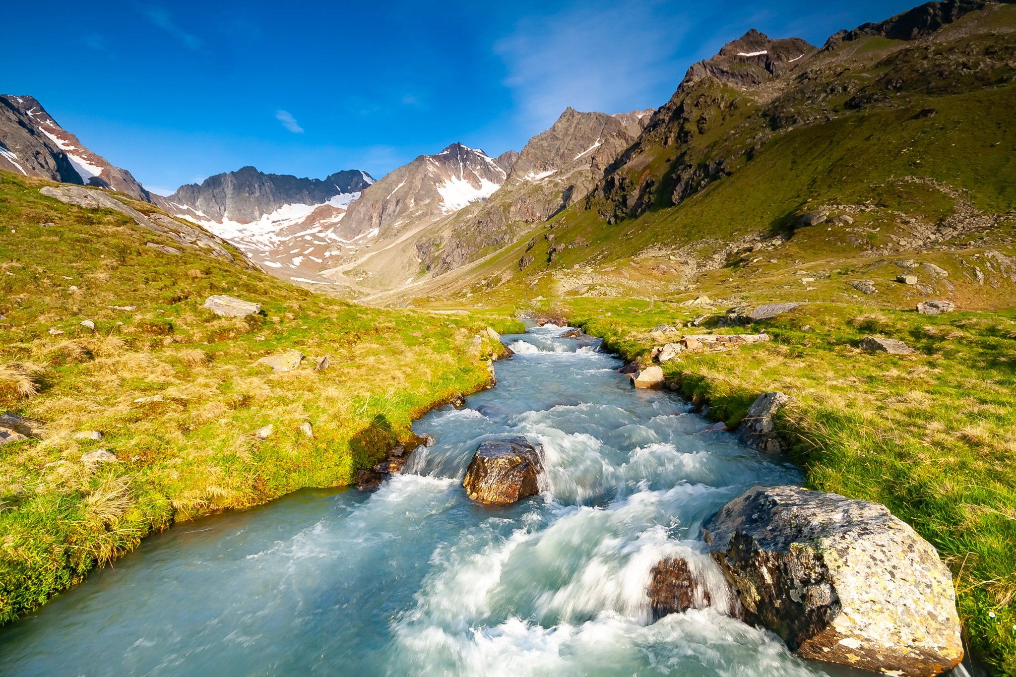 Fresh stream in river coming from glaciers up the valley near Neue Regensburger huette, Stubai Tyrol Alps, Austria