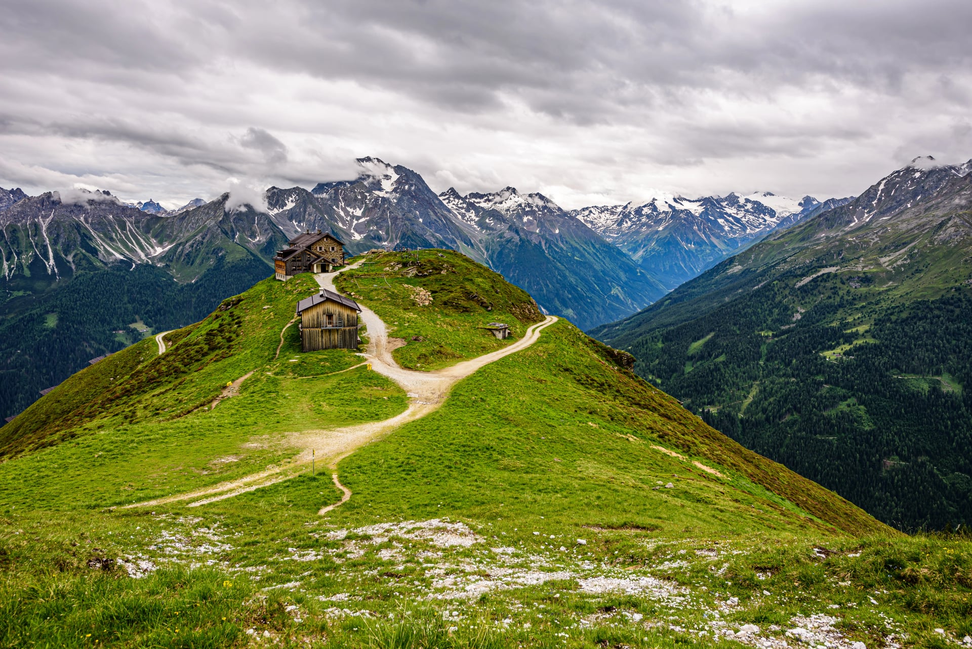 A mountain trail leading from Hoher Burgstall summit towards Starkenburger Hut in austrian Stubai Alps.